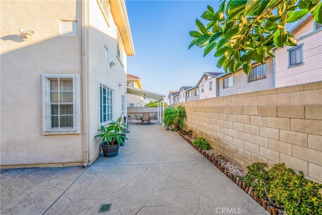 11411 Elliott Ave, El Monte, CA 91732 - view of home's exterior featuring stucco siding, a patio, and a fenced backyard