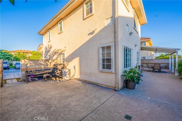 11411 Elliott Ave, El Monte, CA 91732 - view of side of home featuring stucco siding and a patio area