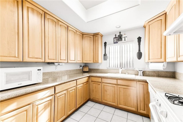11411 Elliott Ave, El Monte, CA 91732 - kitchen with white appliances, light brown cabinetry, light tile patterned floors, light countertops, and wall chimney exhaust hood