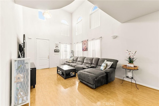 11411 Elliott Ave, El Monte, CA 91732 - living area featuring light wood finished floors and a towering ceiling