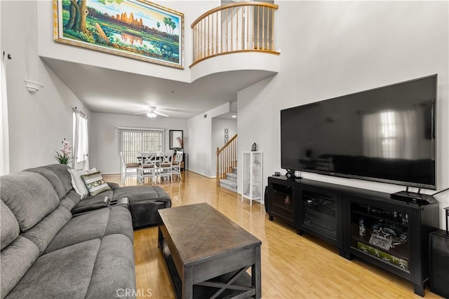 11411 Elliott Ave, El Monte, CA 91732 - living room with stairway, a towering ceiling, wood finished floors, and a ceiling fan