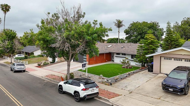 4380 Rolfe Rd, San Diego, CA 92117 - view of front of house featuring driveway, a front lawn, and a garage