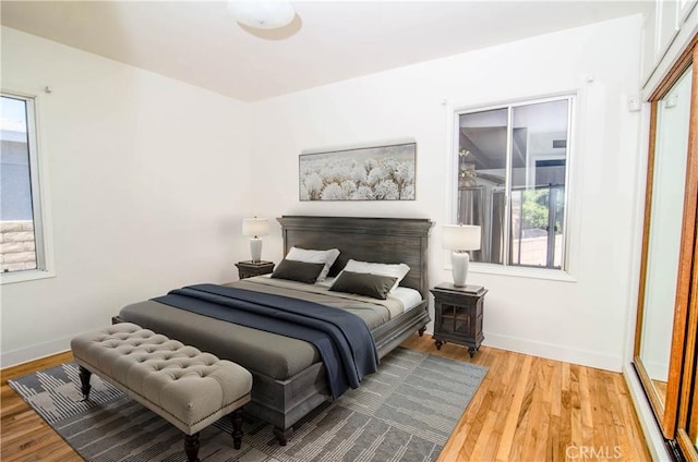 10520 Haskell Ave, Granada Hills, CA 91344 - bedroom featuring baseboards and wood finished floors