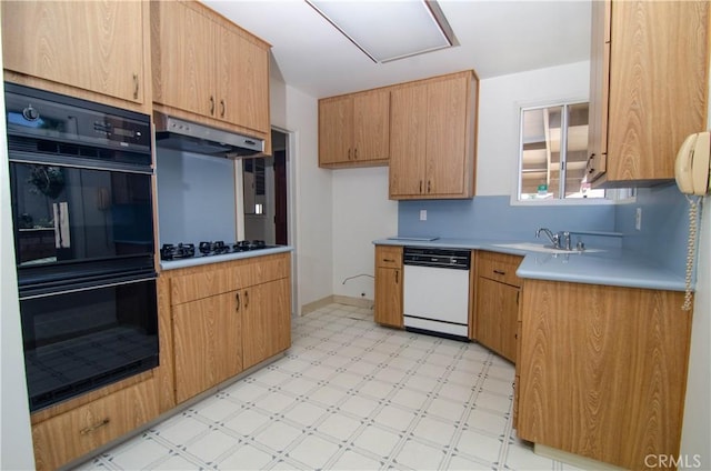 10520 Haskell Ave, Granada Hills, CA 91344 - kitchen featuring black appliances, under cabinet range hood, light flooring, and light countertops