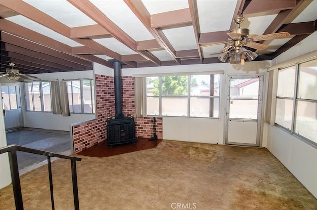 10520 Haskell Ave, Granada Hills, CA 91344 - unfurnished sunroom with a wood stove and beam ceiling