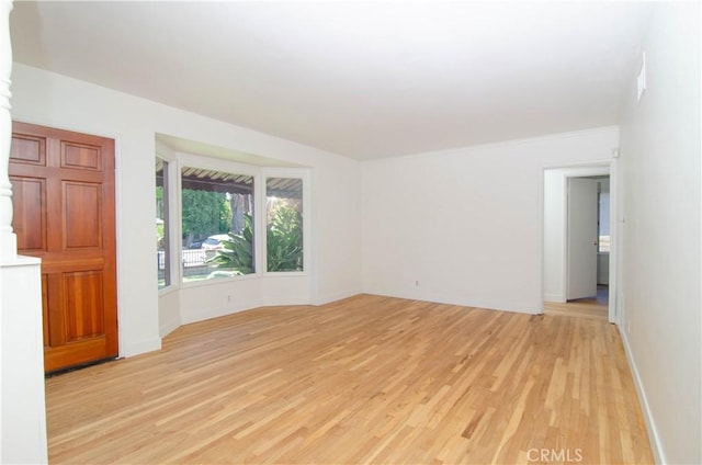 10520 Haskell Ave, Granada Hills, CA 91344 - empty room with light wood-style flooring and baseboards