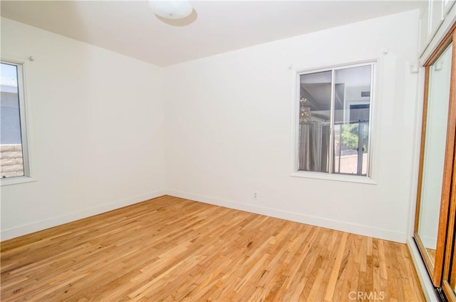 10520 Haskell Ave, Granada Hills, CA 91344 - empty room with light wood finished floors and baseboards
