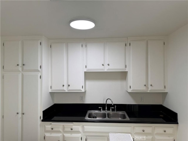 1164 Irving Ave, Glendale, CA 91201 - kitchen with dark countertops and white cabinetry