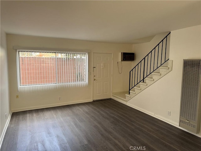 1164 Irving Ave, Glendale, CA 91201 - entrance foyer featuring a heating unit, dark wood finished floors, stairs, and plenty of natural light