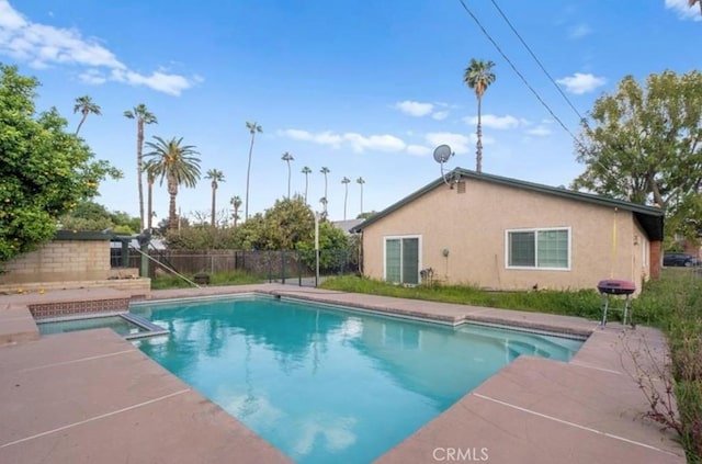 7915 Helena Ave, Riverside, CA 92504 - view of pool featuring a fenced backyard and a pool with connected hot tub