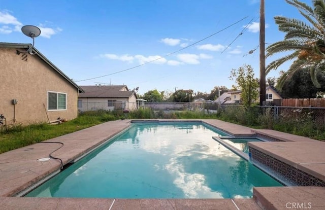 7915 Helena Ave, Riverside, CA 92504 - view of pool with a fenced backyard and a pool with connected hot tub
