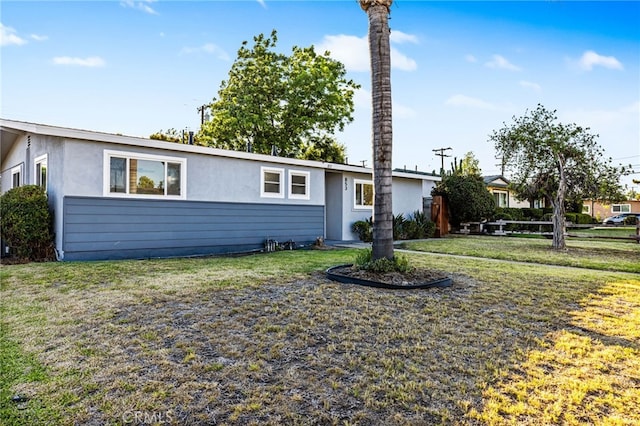 853 N Jasmine Ave, Ontario, CA 91762 - ranch-style house featuring stucco siding and a front lawn