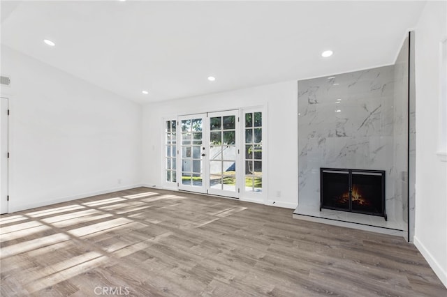 853 N Jasmine Ave, Ontario, CA 91762 - unfurnished living room with wood finished floors, a high end fireplace, and recessed lighting