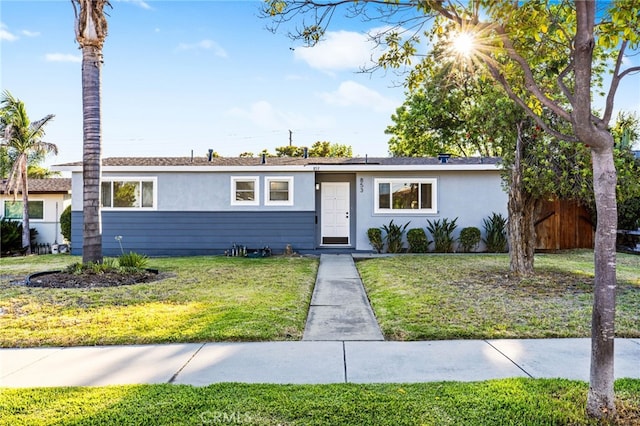 853 N Jasmine Ave, Ontario, CA 91762 - ranch-style house featuring stucco siding and a front yard