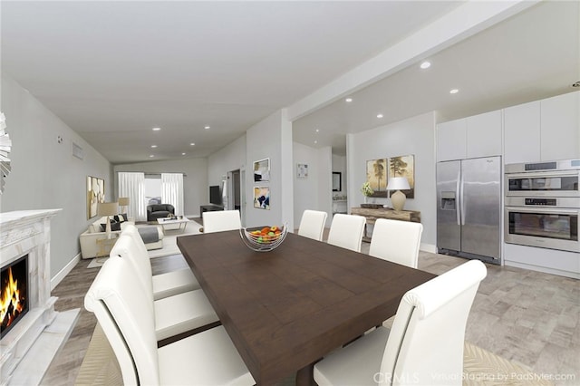 110 S Baymar St, West Covina, CA 91791 - dining room featuring recessed lighting, a fireplace, and light wood-type flooring