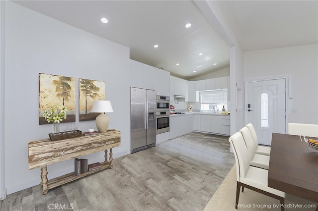 110 S Baymar St, West Covina, CA 91791 - kitchen with stainless steel refrigerator with ice dispenser, light wood-style flooring, light countertops, white cabinetry, and recessed lighting