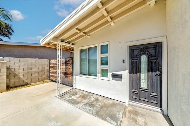 110 S Baymar St, West Covina, CA 91791 - doorway to property featuring stucco siding and a patio