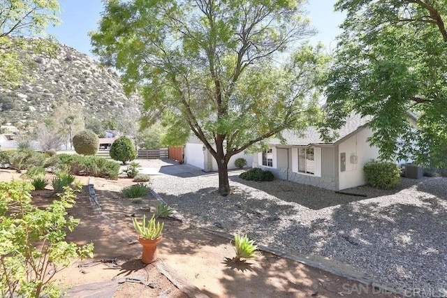 25119 Como Esta Ct, Ramona, CA 92065 - view of front of property with stone siding, concrete driveway, and a garage