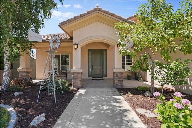 1018 W 15th St, Upland, CA 91786 - property entrance featuring stucco siding, a tiled roof, and stone siding