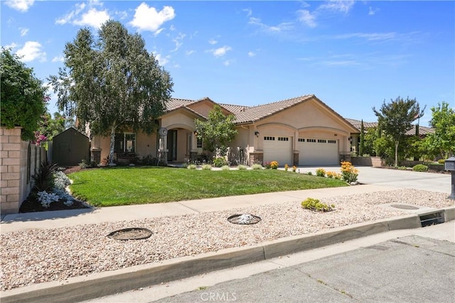1018 W 15th St, Upland, CA 91786 - view of front of house featuring an attached garage, a front lawn, stucco siding, a tiled roof, and driveway