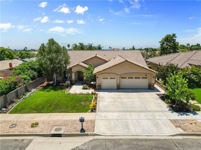 1018 W 15th St, Upland, CA 91786 - view of front of house featuring an attached garage, driveway, a tiled roof, and stucco siding