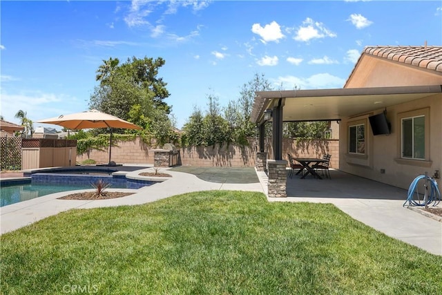 1018 W 15th St, Upland, CA 91786 - fenced backyard featuring a patio area, a hot tub, and a storage unit