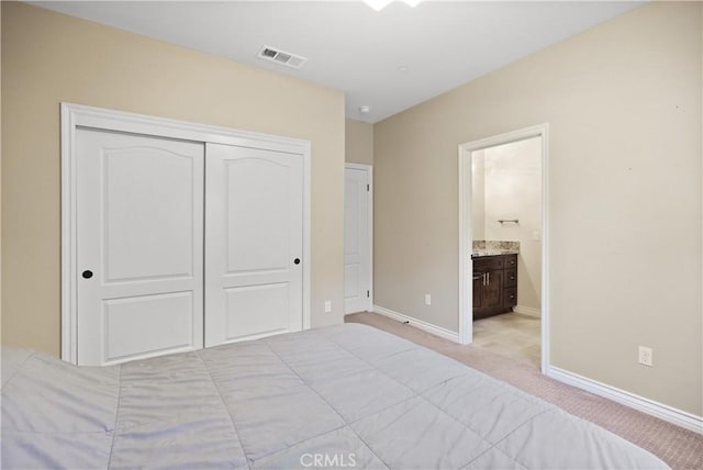 1018 W 15th St, Upland, CA 91786 - bedroom with light carpet, a closet, and ensuite bathroom