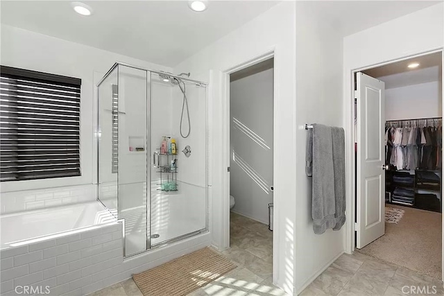 12465 Gramercy Ln, Victorville, CA 92392 - bathroom featuring a stall shower, a bath, a walk in closet, and recessed lighting