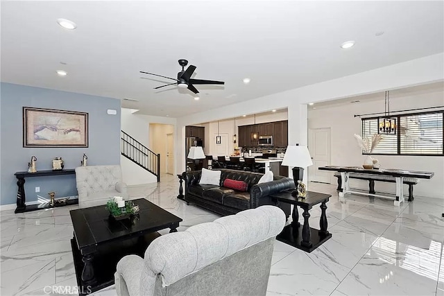 12465 Gramercy Ln, Victorville, CA 92392 - living area featuring light marble finish floors, a ceiling fan, recessed lighting, and stairway