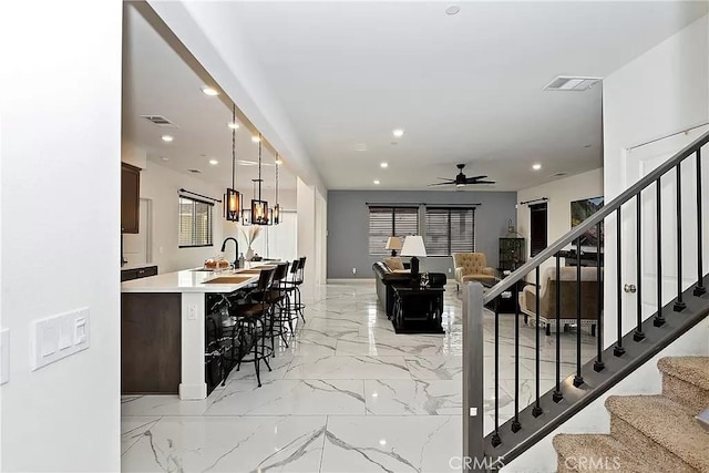 12465 Gramercy Ln, Victorville, CA 92392 - living area with a ceiling fan, light marble finish floors, stairs, and recessed lighting