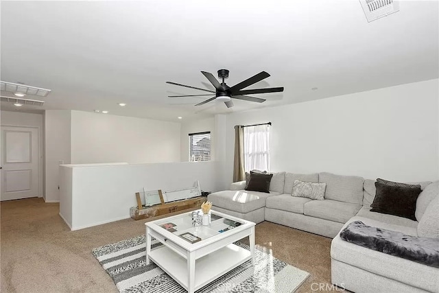 12465 Gramercy Ln, Victorville, CA 92392 - living area featuring light colored carpet, a ceiling fan, and recessed lighting