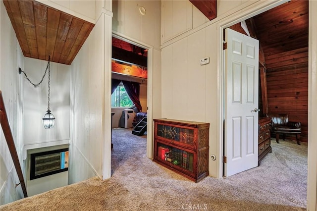 463 Delle Dr, Crestline, CA 92325 - corridor with wooden ceiling, carpet flooring, wooden walls, and vaulted ceiling