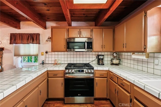 463 Delle Dr, Crestline, CA 92325 - kitchen featuring appliances with stainless steel finishes, a wooden ceiling with exposed beams, dark wood-style flooring, and backsplash