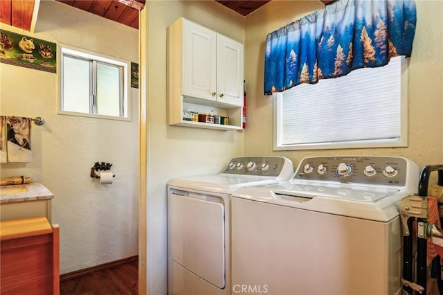 463 Delle Dr, Crestline, CA 92325 - laundry room featuring washing machine and clothes dryer, dark wood-style floors, and cabinet space