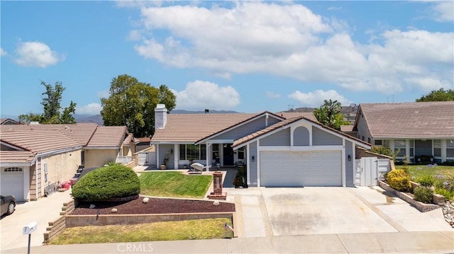 28219 Langside Ave, Canyon Country, CA 91351 - ranch-style home with a tile roof, a garage, driveway, and a chimney
