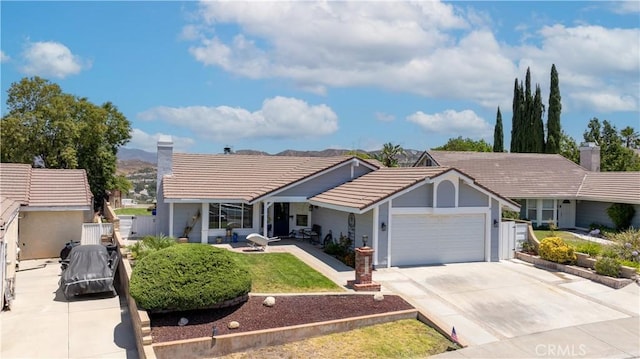 28219 Langside Ave, Canyon Country, CA 91351 - ranch-style home featuring a chimney, an attached garage, a tile roof, and concrete driveway