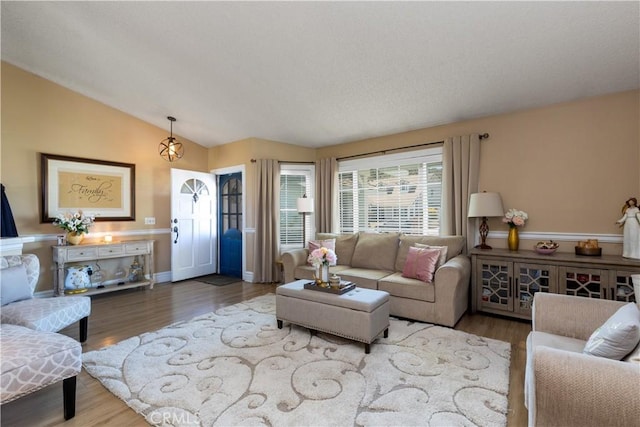 28219 Langside Ave, Canyon Country, CA 91351 - living room featuring lofted ceiling and wood finished floors