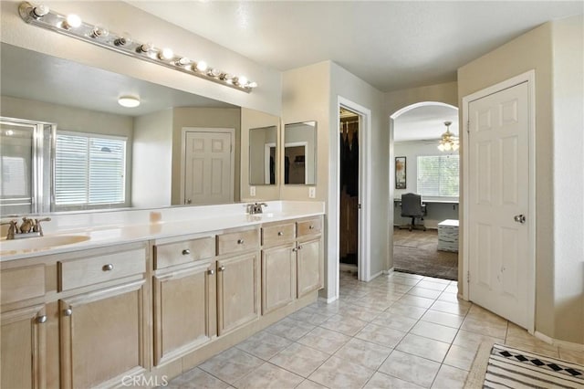 16074 Coyote Springs Ct, Moreno Valley, CA 92551 - full bath featuring double vanity, a ceiling fan, a walk in closet, and tile patterned flooring