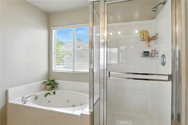 16074 Coyote Springs Ct, Moreno Valley, CA 92551 - full bathroom featuring a stall shower and a tub with jets