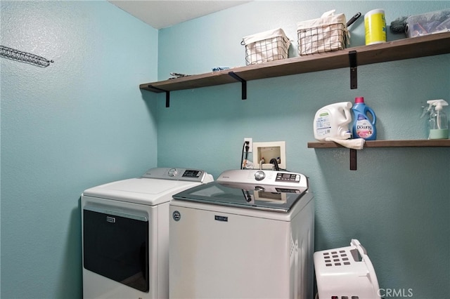 16074 Coyote Springs Ct, Moreno Valley, CA 92551 - washroom with washing machine and clothes dryer and a textured wall