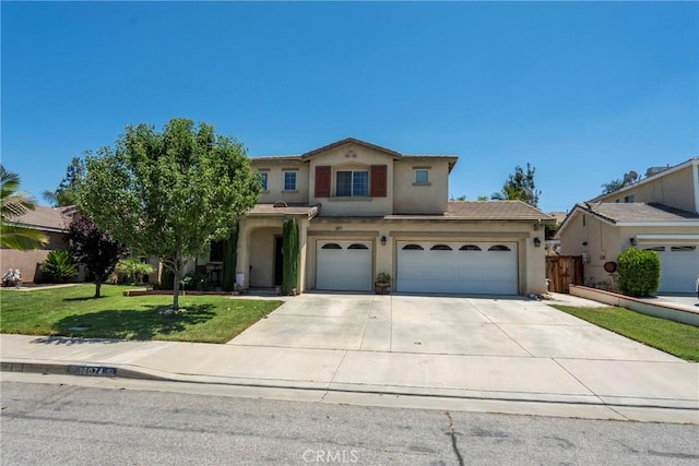 16074 Coyote Springs Ct, Moreno Valley, CA 92551 - view of front of house with stucco siding, concrete driveway, a front lawn, and an attached garage