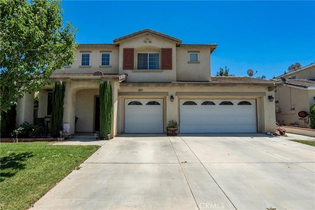 16074 Coyote Springs Ct, Moreno Valley, CA 92551 - mediterranean / spanish home featuring concrete driveway, stucco siding, an attached garage, and a front yard