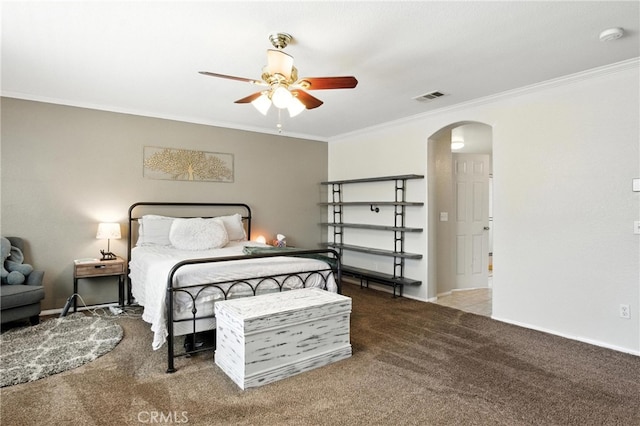 16074 Coyote Springs Ct, Moreno Valley, CA 92551 - carpeted bedroom with arched walkways, crown molding, and ceiling fan
