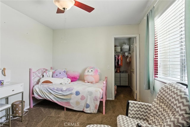 16074 Coyote Springs Ct, Moreno Valley, CA 92551 - carpeted bedroom featuring a walk in closet, multiple windows, a closet, and a ceiling fan