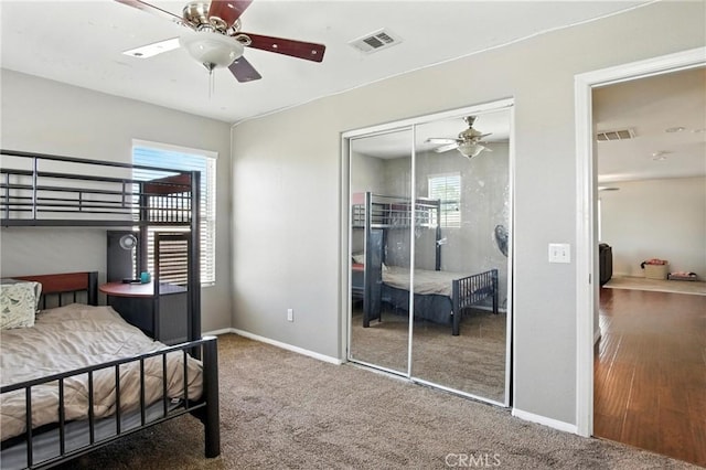 16074 Coyote Springs Ct, Moreno Valley, CA 92551 - carpeted bedroom with a closet and ceiling fan