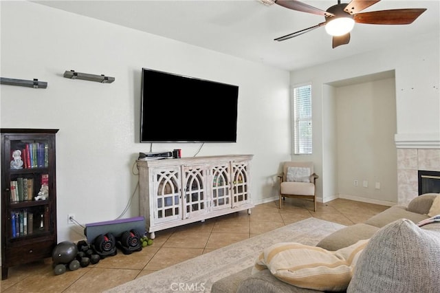 16074 Coyote Springs Ct, Moreno Valley, CA 92551 - living room featuring tile patterned floors, a ceiling fan, and a tiled fireplace