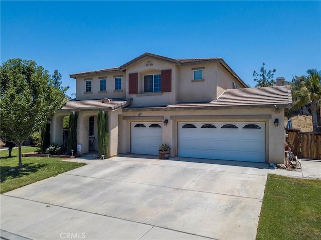 16074 Coyote Springs Ct, Moreno Valley, CA 92551 - mediterranean / spanish-style house featuring stucco siding, a garage, driveway, and a tile roof