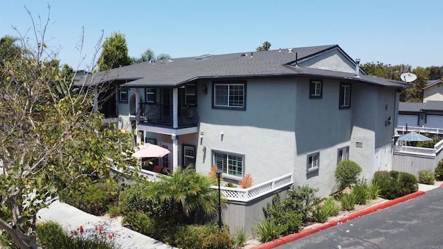 506 Canyon Dr Unit 70, Oceanside, CA 92054 - view of side of property featuring a balcony and stucco siding