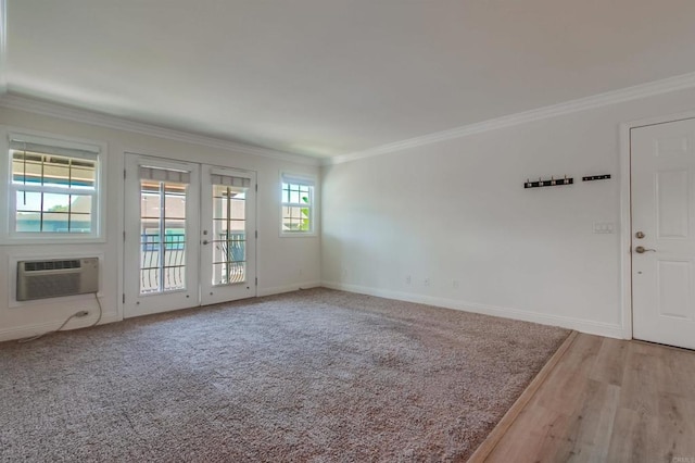 506 Canyon Dr Unit 70, Oceanside, CA 92054 - unfurnished living room with a wall mounted AC, crown molding, french doors, and wood finished floors