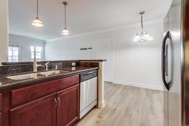 506 Canyon Dr Unit 70, Oceanside, CA 92054 - kitchen featuring stainless steel appliances, reddish brown cabinets, crown molding, light wood-type flooring, and a chandelier